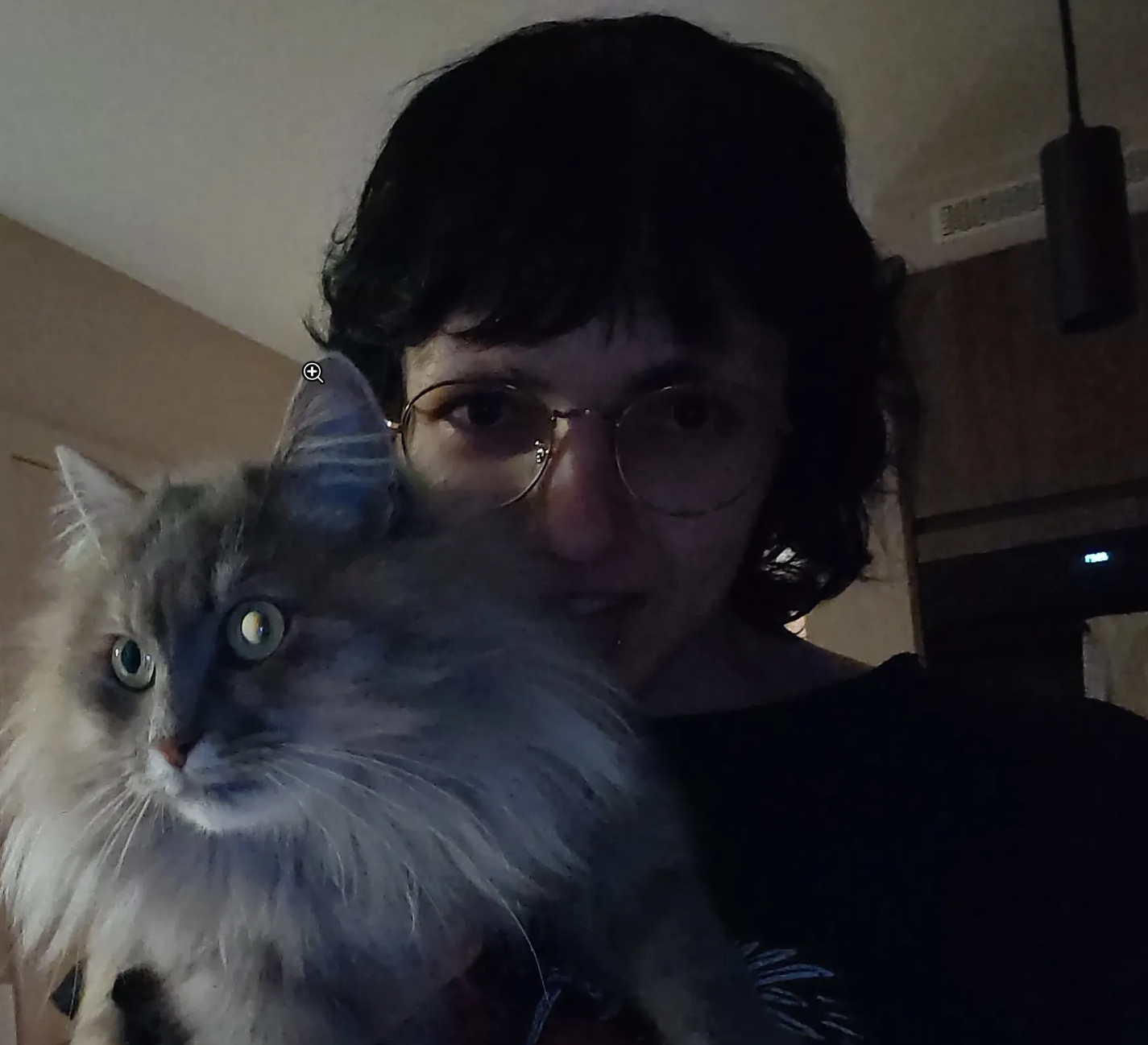 Me holding a fluffy kitty.